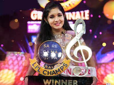 Sa Re Ga Ma Pa Keralam Li L Champs Winner Singer Anagha Ajay Lifts The Trophy Wins A Prize Money Of Rs 10 Lakh Times Of India