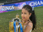 Ziva proudly lifts the IPL 2021 trophy