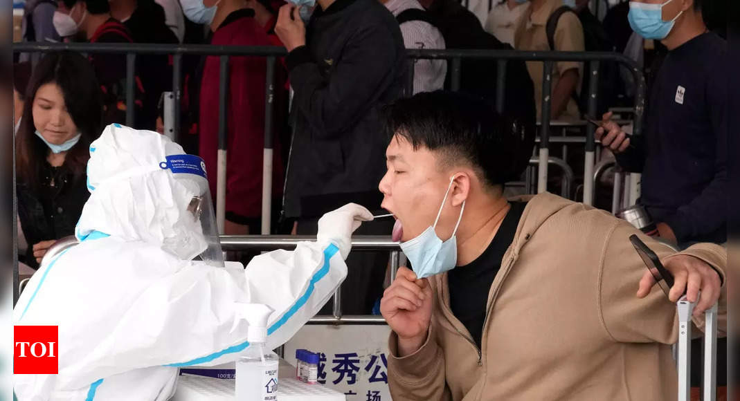 China closes Guangzhou to most arrivals as outbreak spreads – Times of India