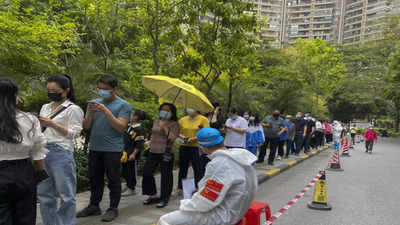 China closes Guangzhou to most arrivals as outbreak spreads