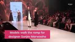 Actress Malaika Arora walks the ramp for designer Sanjev Marwaaha at PTFW '22