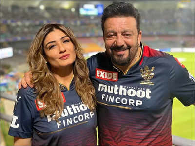 Raveena Tandon and Sanjay Dutt don the RCB jersey for a special night out