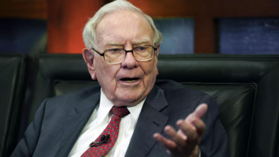 Buffett reveals big investments, rails against Wall St excess at Berkshire meeting