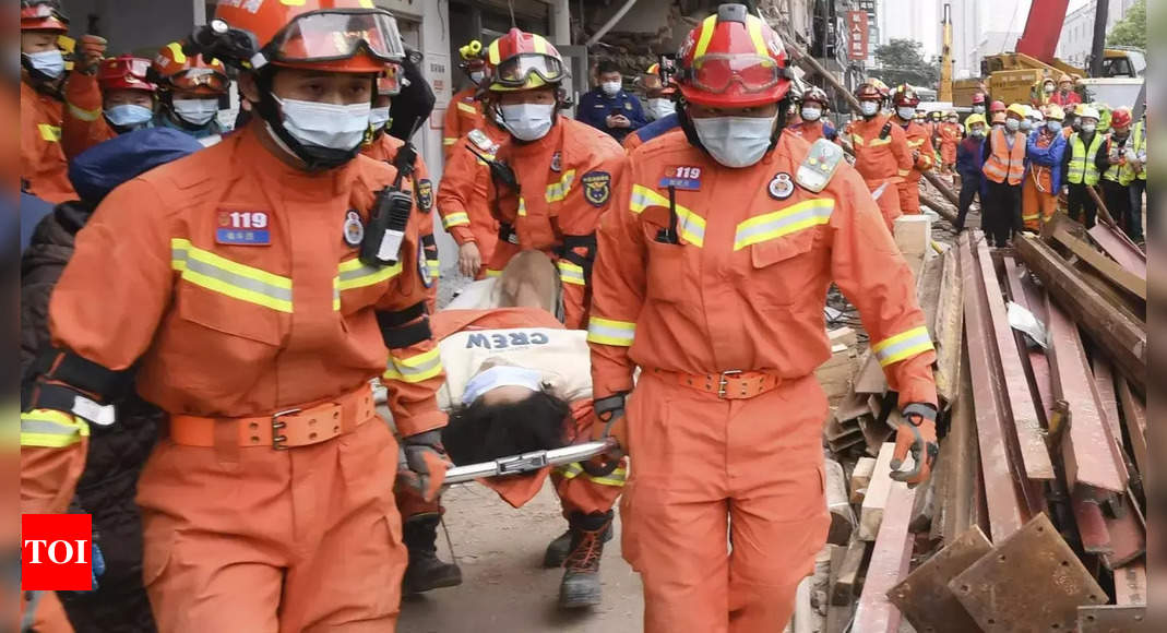 Woman rescued from debris 50 hours after building collapse in China – Times of India