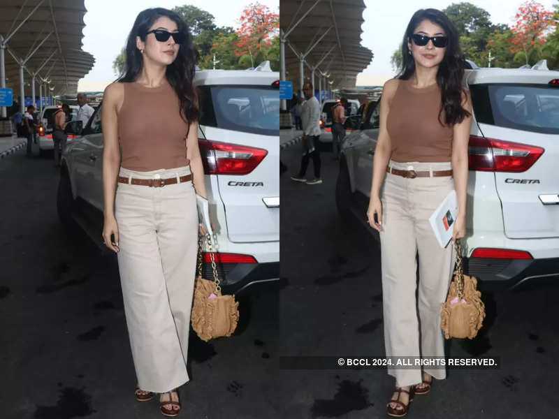 Shehnaaz Gill Makes Heads Turn In A Stylish Look At The Airport Leaves Fans Guessing Where She Is Headed With Brahmakumaris Sister Times Of India