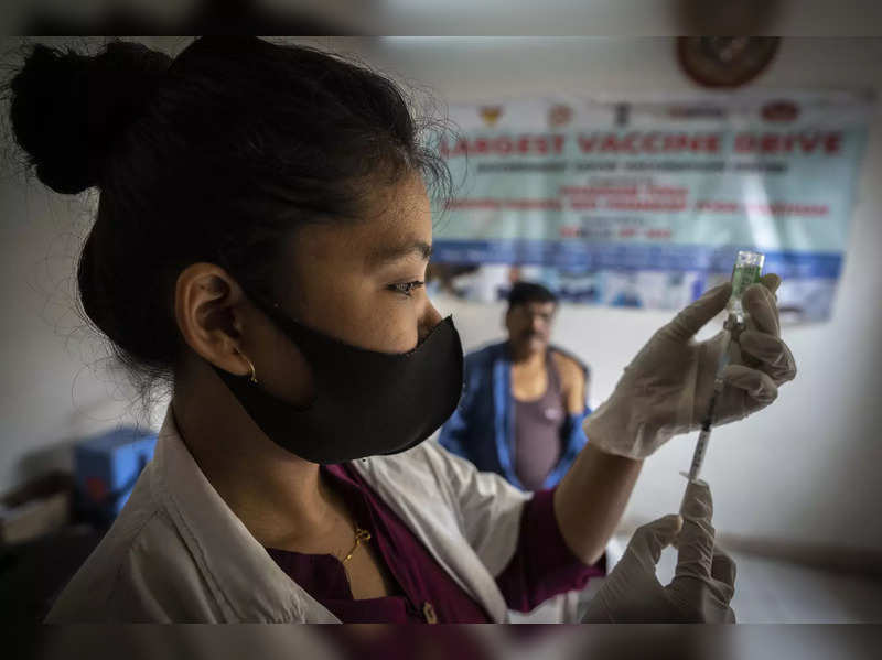 A nurse prepares to administer vaccine for COVID-19 at a private vaccination center in Gauhati, India, Sunday, April 10, 2022. India began offering booster doses of COVID-19 vaccine to all adults on Sunday but limited free shots at government centers to front-line workers and people over age 60. (AP Photo/Anupam Nath)