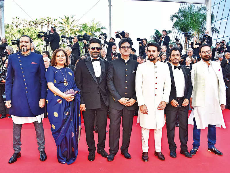 (L – R) Ricky Kej, Vani Tripathi Tikoo, R Madhavan, Prasoon Joshi, Anurag Singh Thakur, Nawazuddin Siddiqui, and Shekhar Kapur at the Cannes opening ceremony