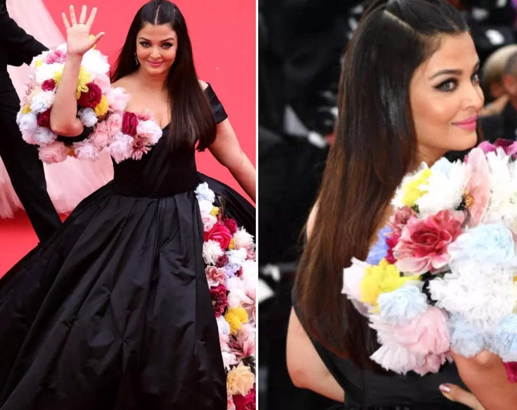 
Aishwarya Rai Bachchan slays at the Cannes red carpet in a black gown with an elaborate flower work; poses with Eva Longoria
