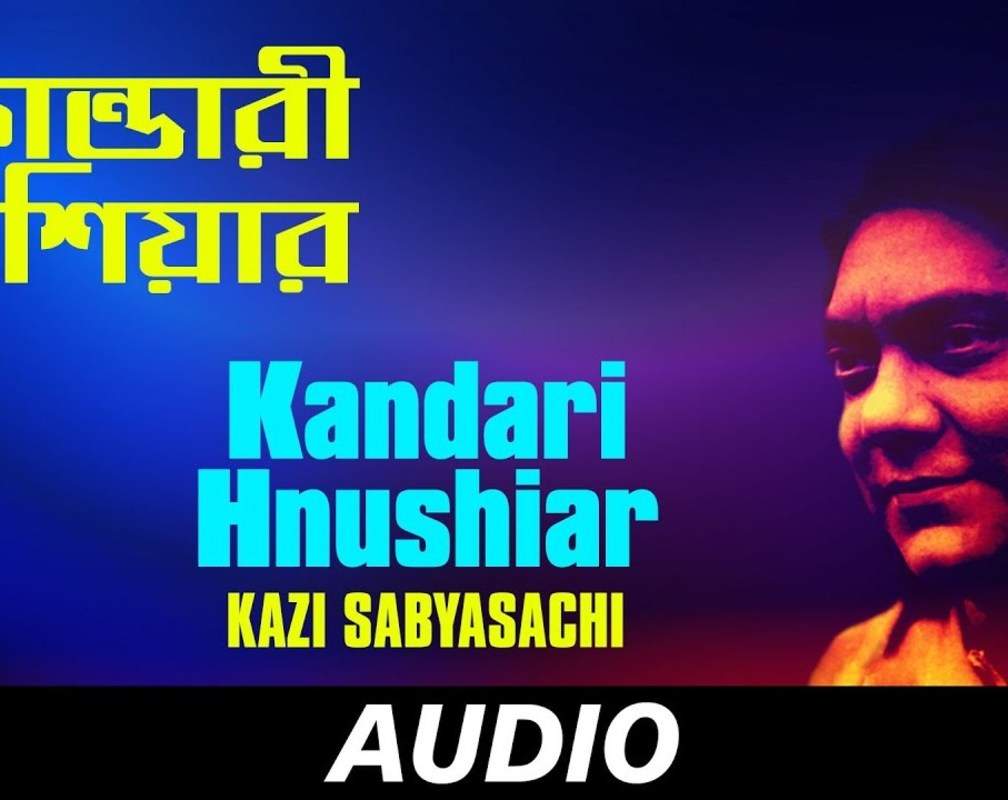 
Listen Popular Bengali Audio Song 'Kandari Hnushiar' Sung By Kazi Sabyasachi
