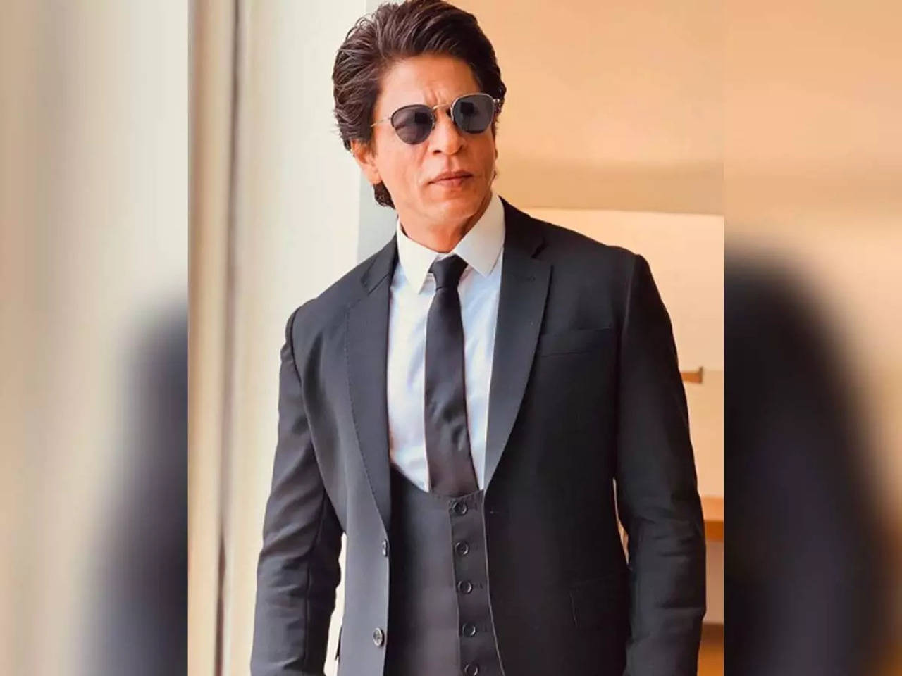 Shah Rukh Khan dons a dapper look in black with braided hair at