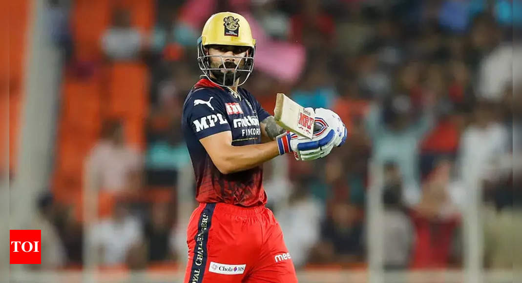 Watch: Pitch invader touches Virat Kohli in IPL Qualifier 2 | Cricket News – Times of India