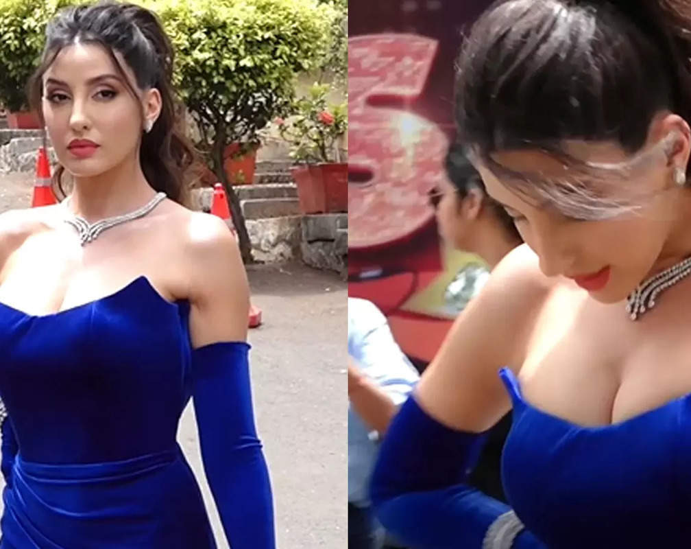 
Nora Fatehi looks gorgeous in blue strapless thigh-high slit gown
