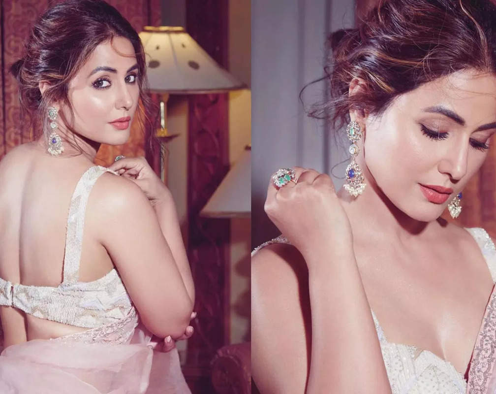 
Hina Khan stuns in a blush pink organza saree with gorgeous blouse with sweetheart neckline
