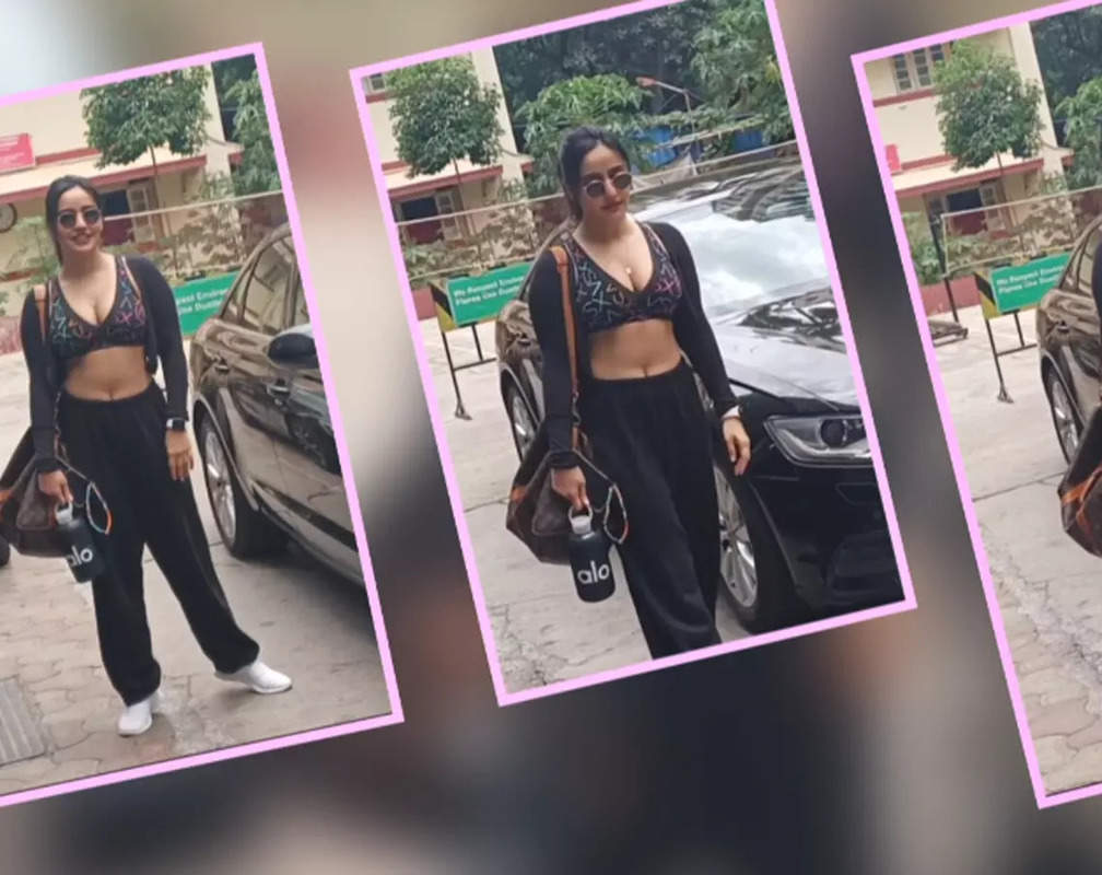 
Neha Sharma gets papped in black sports brassiere coupled with a pair of simple black track pants and white sneakers
