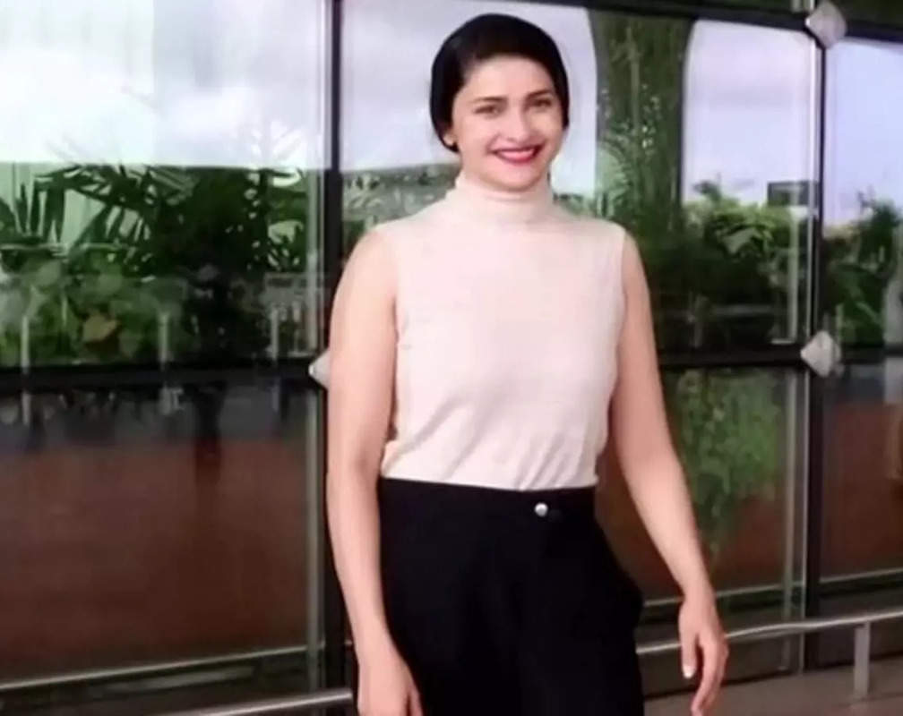 
Spotted! Prachi Desai wears high neck cream top and black jeans
