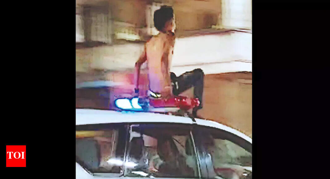 Drunk Man Takes Joyride Atop Cop Car | Hyderabad News - Times of India