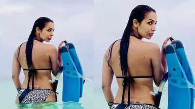 Malaika Arora flaunts her back, stuns in a black animal-printed bikini