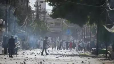 Protesters throw stones towards police during a protest in Prayagraj. (File photo)