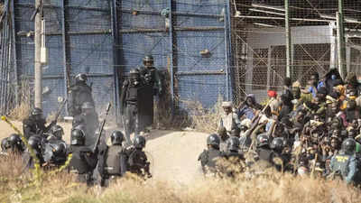 Dozens of migrants piled on the ground in Melilla disaster, rights group says