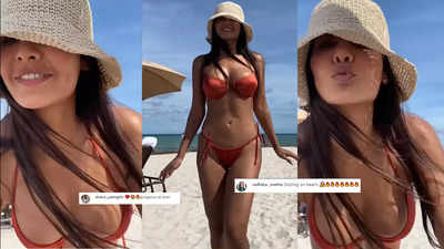 Esha Gupta flaunts her envious curves in a red bikini, a fan says 'sizzling on the beach'