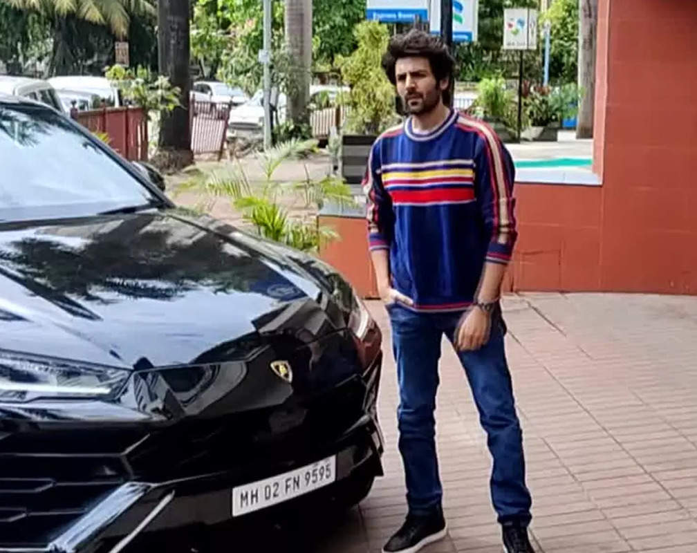 
Kartik Aaryan gets snapped in admiral blue top with multi-coloured lining and blue jeans
