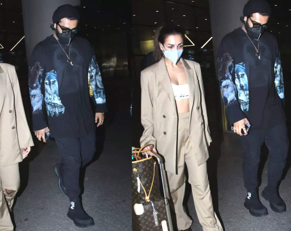 
Arjun Kapoor protects ladylove Malaika Arora from getting mobbed at airport as the couple returns from Paris
