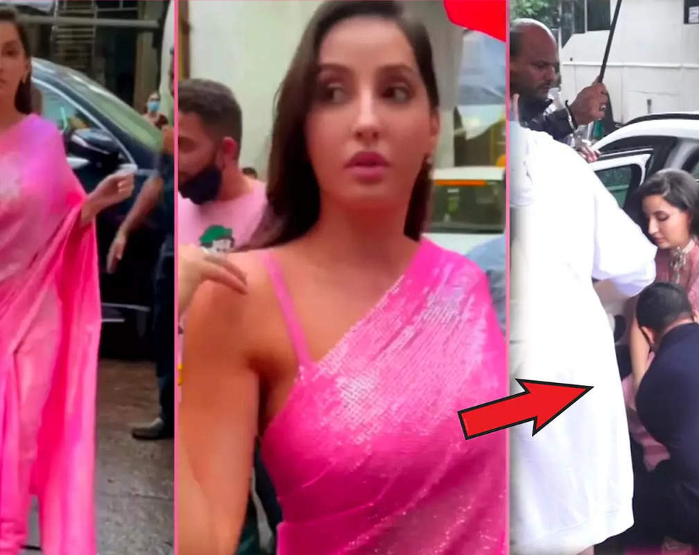 
Nora Fatehi gets slammed by netizens for making the security guard hold her saree: ‘Not even a thank you’
