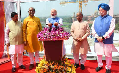 PM Modi unveils national emblem on top of new Parliament building