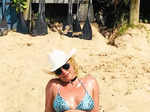 Slaying in a bikini, Britney soaks up the sun on an island.