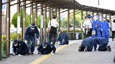 Investigators work at the scene of former Japanese PM Shinzo Abe's assassination, in Nara, Japan. (Reuters photo) banner img