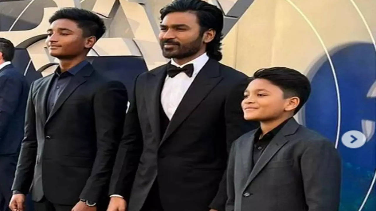 Dhanush attends The Gray Man premiere with sons Linga, Yathra. See