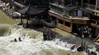China floods leave at least 12 dead, thousands evacuated