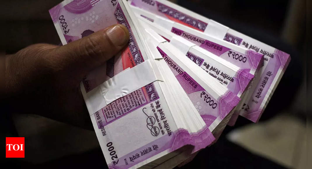 Rupee settles at record low of 79.98 against US dollar; briefly touches 80/$ mark – Times of India