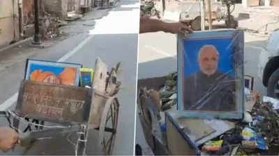 PM Narendra Modi, Uttar Pradesh CM Yogi Adityanath pics in garbage cart: Safai union demands job for fired worker