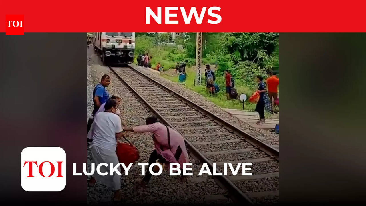 Watch: Careless passengers survive fast approaching train