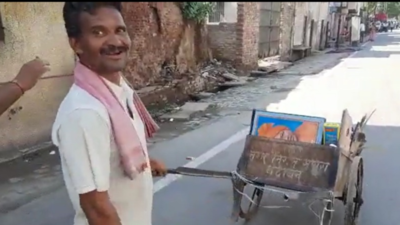 UP sanitation worker sacked for carrying pictures of PM Modi and CM Yogi Adityanath in garbage cart reinstated