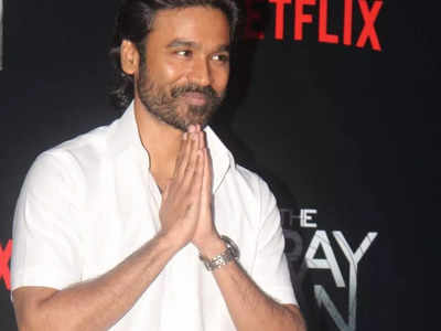 Dhanush appears in a traditional 'Veshti' and shirt at 'The Gray Man' premiere