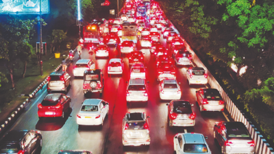 Motorists take shelter from showers under flyovers, roads choke in Noida