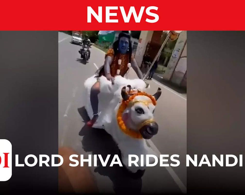 
Kanwar Yatra 2022: Varanasi man dressed as Lord Shiva rides Nandi bike
