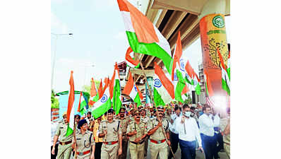 Not just flowers, govt officers of west UP districts greet kanwariyas with national flags too