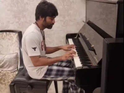 Video of Dhanush playing the piano