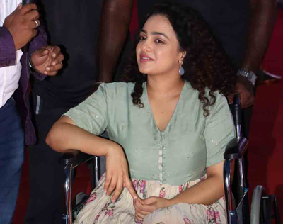 Injured Nithya Menen turns up on wheel chair for Thiruchitrambalam audio launch Tamil Movie News