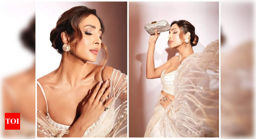 Malaika Arora looks drop-dead gorgeous in this sheer ivory saree