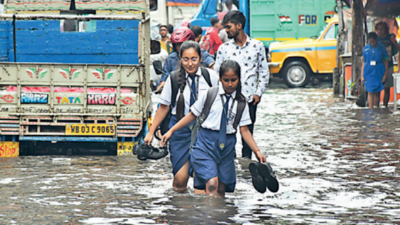 Craters turn roads risky as sharp showers flood north, central Kolkata