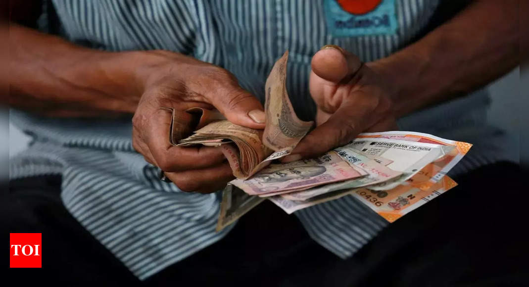 Rupee weakens after four days of gains on record trade deficit – Times of India