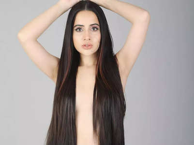 Urfi covers breasts with fake hair extensions