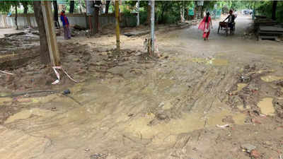 Noida: Sector Alpha 1 road riddled with potholes for years, made worse by rain