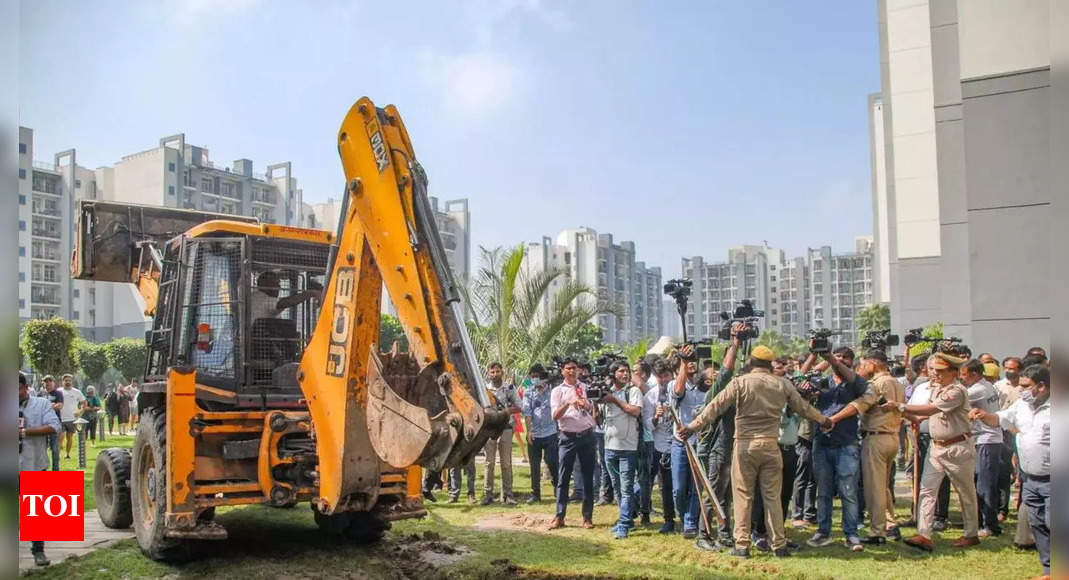 bulldozers-raze-parts-of-flat-of-absconding-noida-neta-residents-want-shrikant-tyagi-arrested-at-the-earliest-or-india-news-times-of-india