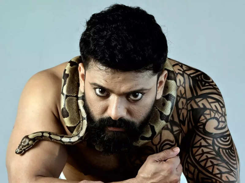 Bigg Boss Malayalam winner Manikuttan's daredevil photoshoot with a python leaves fans stunned