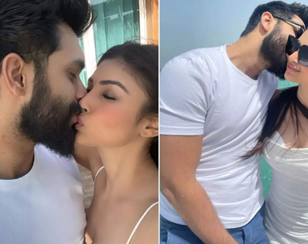 
Mouni Roy and Suraj Nambiar share a passionate kiss on a yacht
